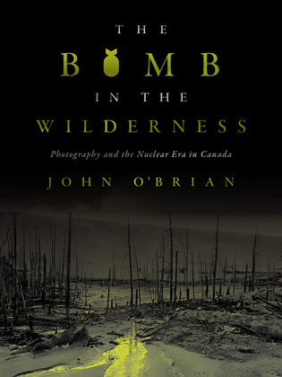 Cover: The Bomb in the Wilderness: Photography and the Nuclear Era in Canada, by John O&#039;Brian. photo: a burned-out forest with barren trees that have no branches or leaves on them and a pool of glowing green water flowing into the forest. The O in Bomb is tylized to look like a nuclear warhead.