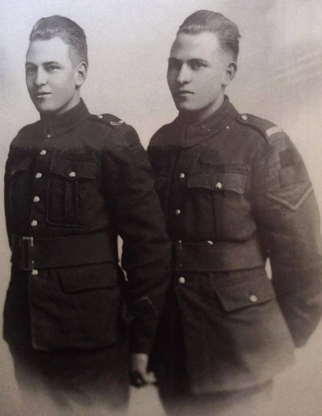 Black and white photograph of twins, Arnold and Clarence Westcott, both in uniform.
