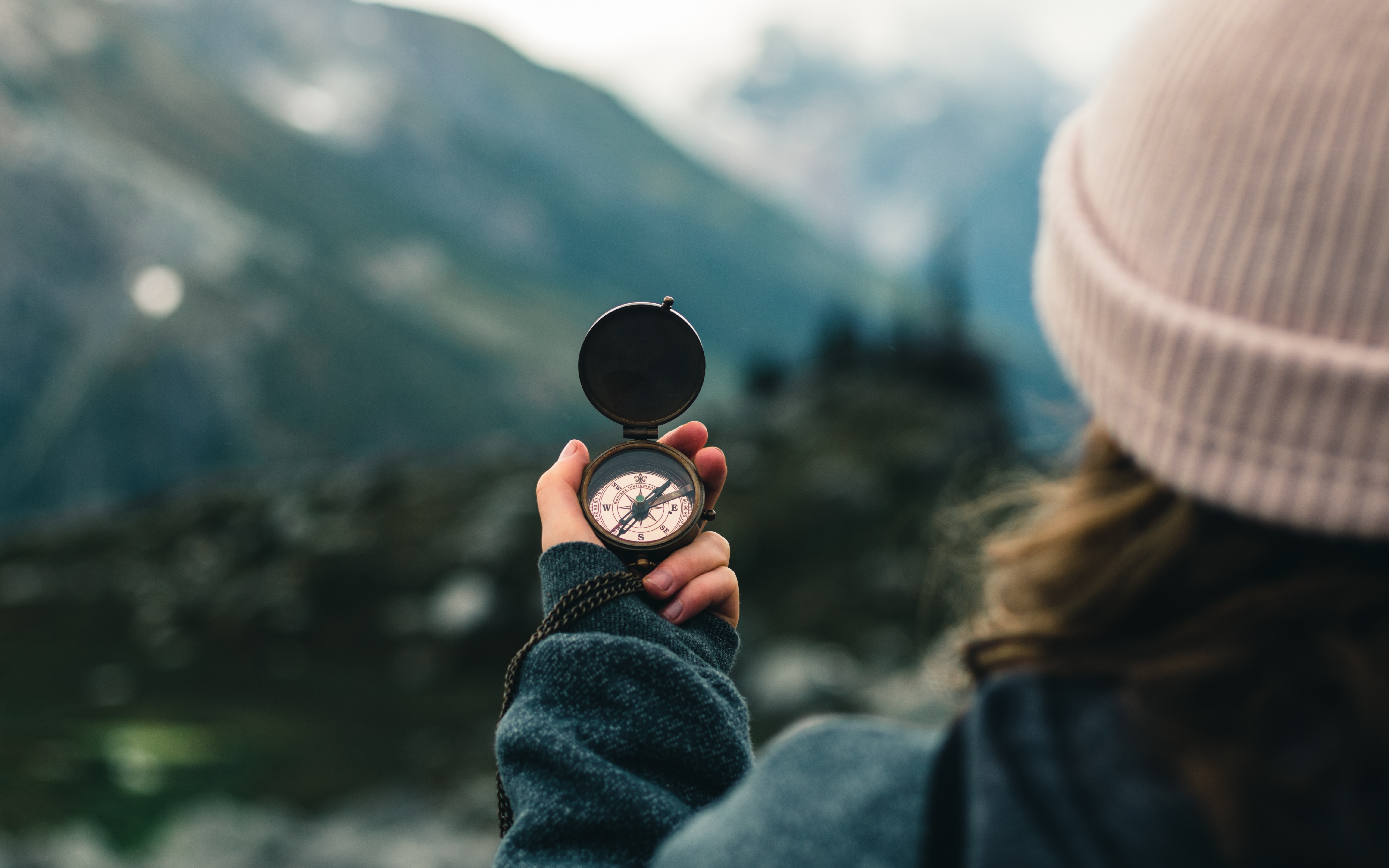 Photo of a woman holding a compass